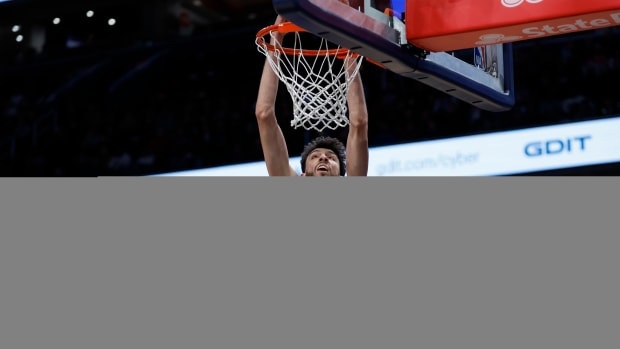 Jan 8, 2024; Washington, District of Columbia, USA; Oklahoma City Thunder forward Chet Holmgren (7) dunks the ball as Washington Wizards forward Deni Avdija (8) looks on in the first quarter at Capital One Arena.